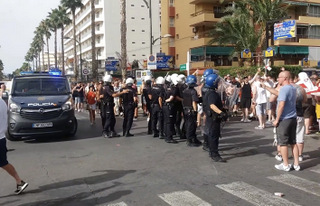 Riot police line
